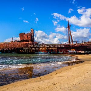 Gythio - May 2019. Probably one of the most photographed sites in Gythio! The Dimitrios shipwreck at Valtaki Beach still clings on for dear life!