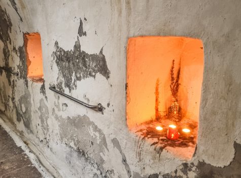 Lesvos 2022 Interior of the Eftalou thermal springs with stone basin and tealight candles.