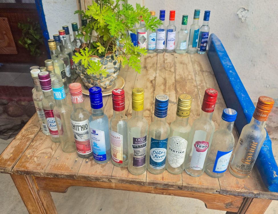 Blue Sardine Collection of Ouzo bottles at Blue Sardin