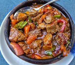 Sizzling beef casserole with peppers cooked Aegean style at Sandal Restaurant in Bozcaada